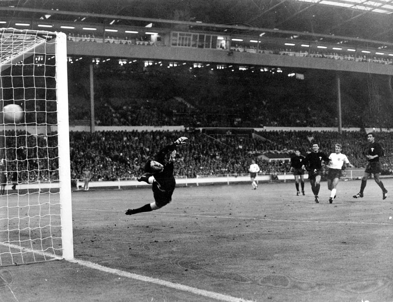 Bobby Charlton scores against Mexico in 1966.